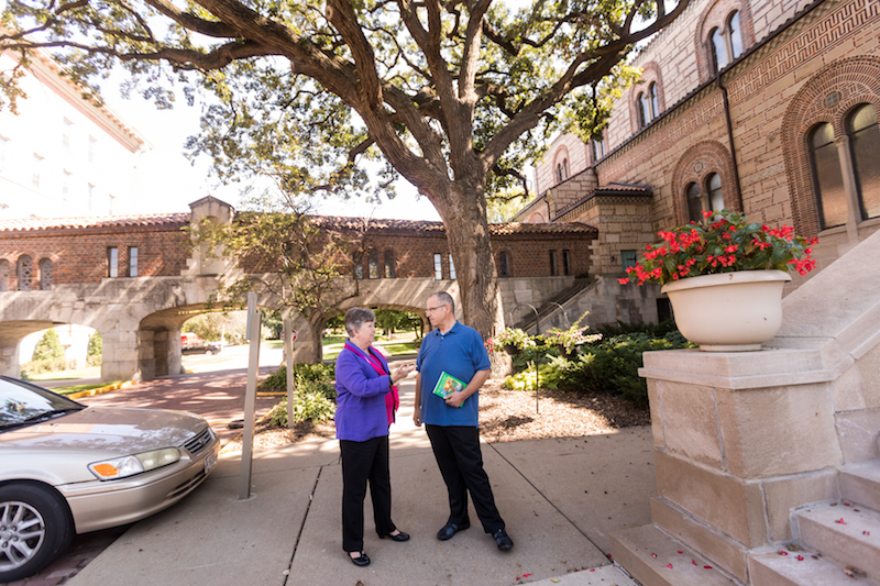 Sr. Jean Wincek and Professor Jeff Johnson talk outside the Chapel