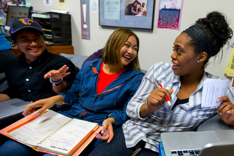 Three students in St. Kate's MIPS program laughing