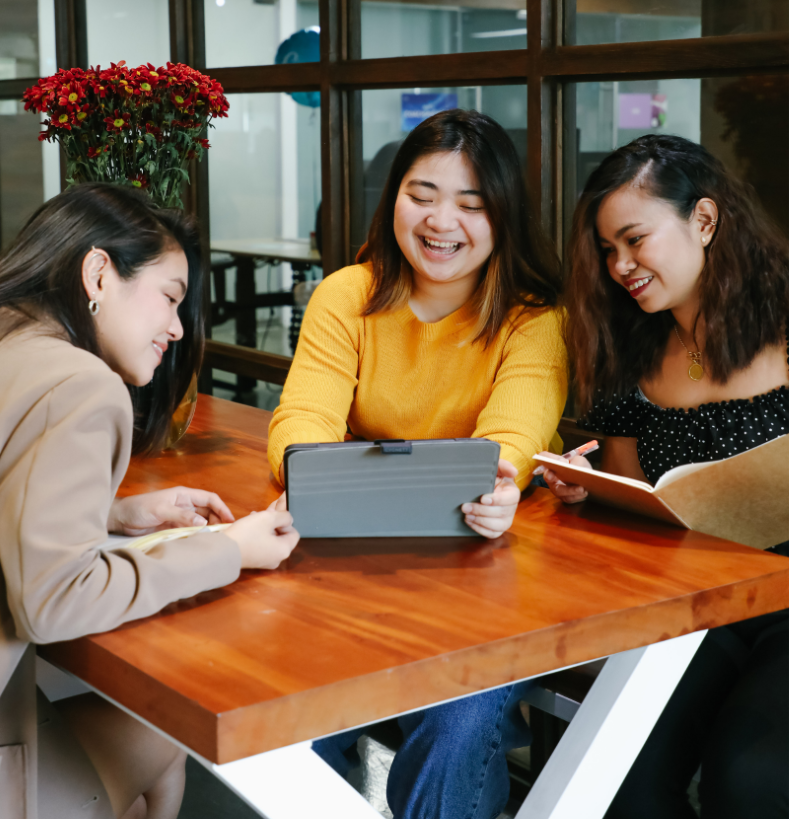 Data Science students working at a table in a group