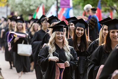 graduates walking to ceremony