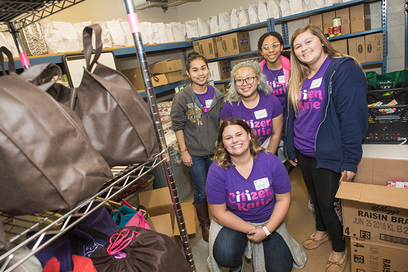 Students donating help at local food shelf