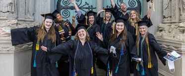 CFA graduates posing for picture at ceremony